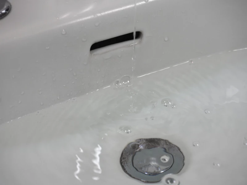 Sinked filled with water leaking from tap