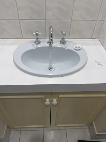 New basin taps installed on a bathroom vanity in Woodlands