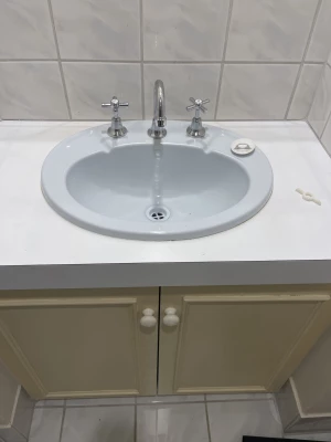 New basin taps installed on a bathroom vanity in Woodlands