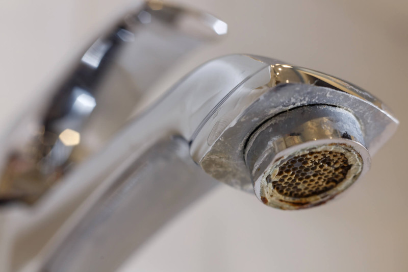 Mineral build-up in a tap from hard water