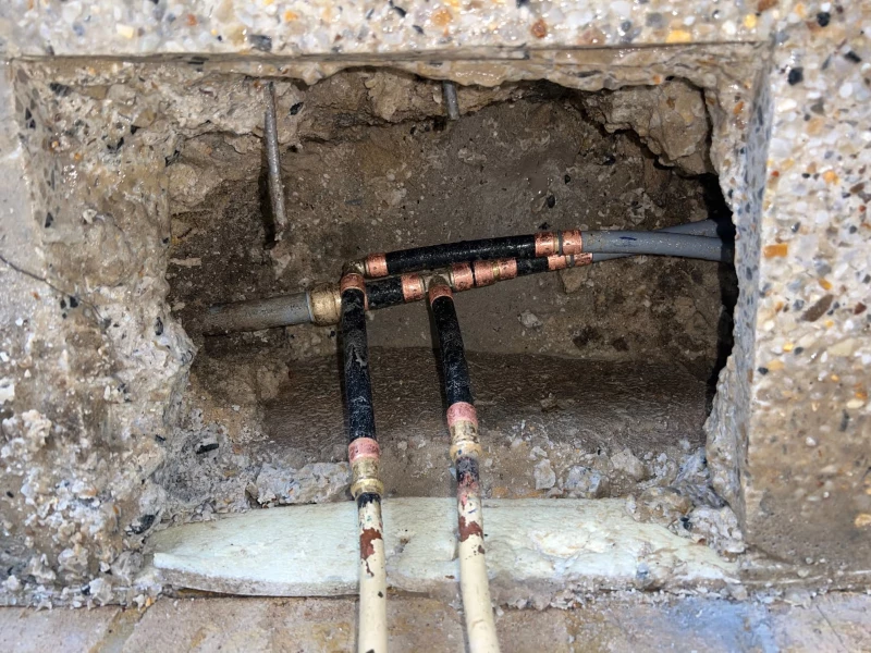 Noranda job with leaking under concrete slab