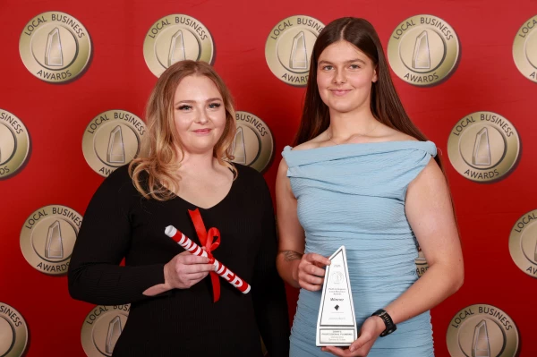 Sarah and Savannah accepting the Outstanding Service & Trade category at the 2026 Perth & Regions Local Business Awards.