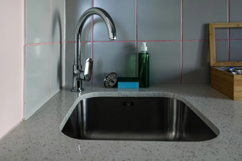 A blocked kitchen sink needing unblocking