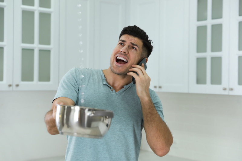 Man dealing with a plumbing emergency