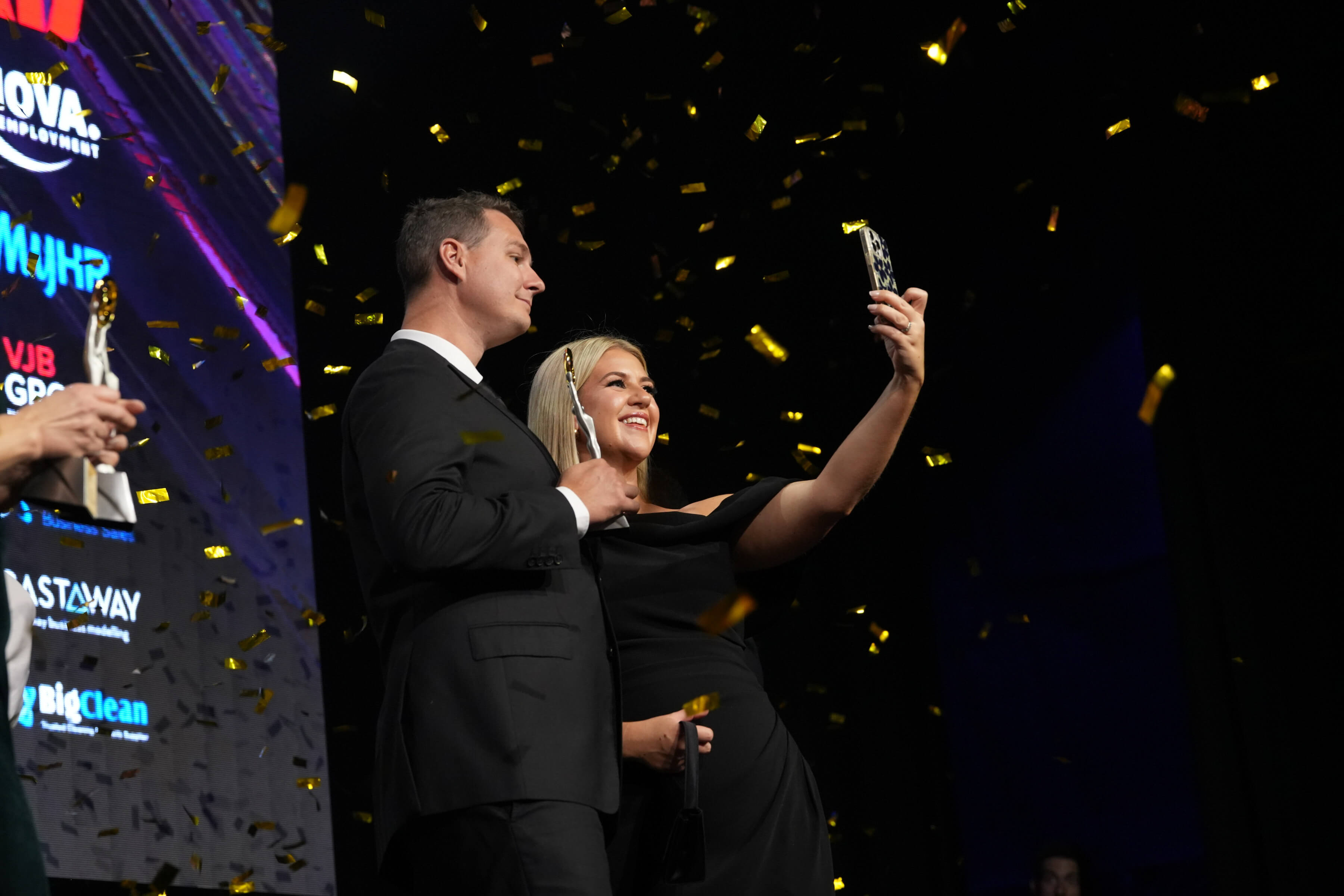 Michael Swan on stage celebrating his win at the Australian Small Business Champion awards