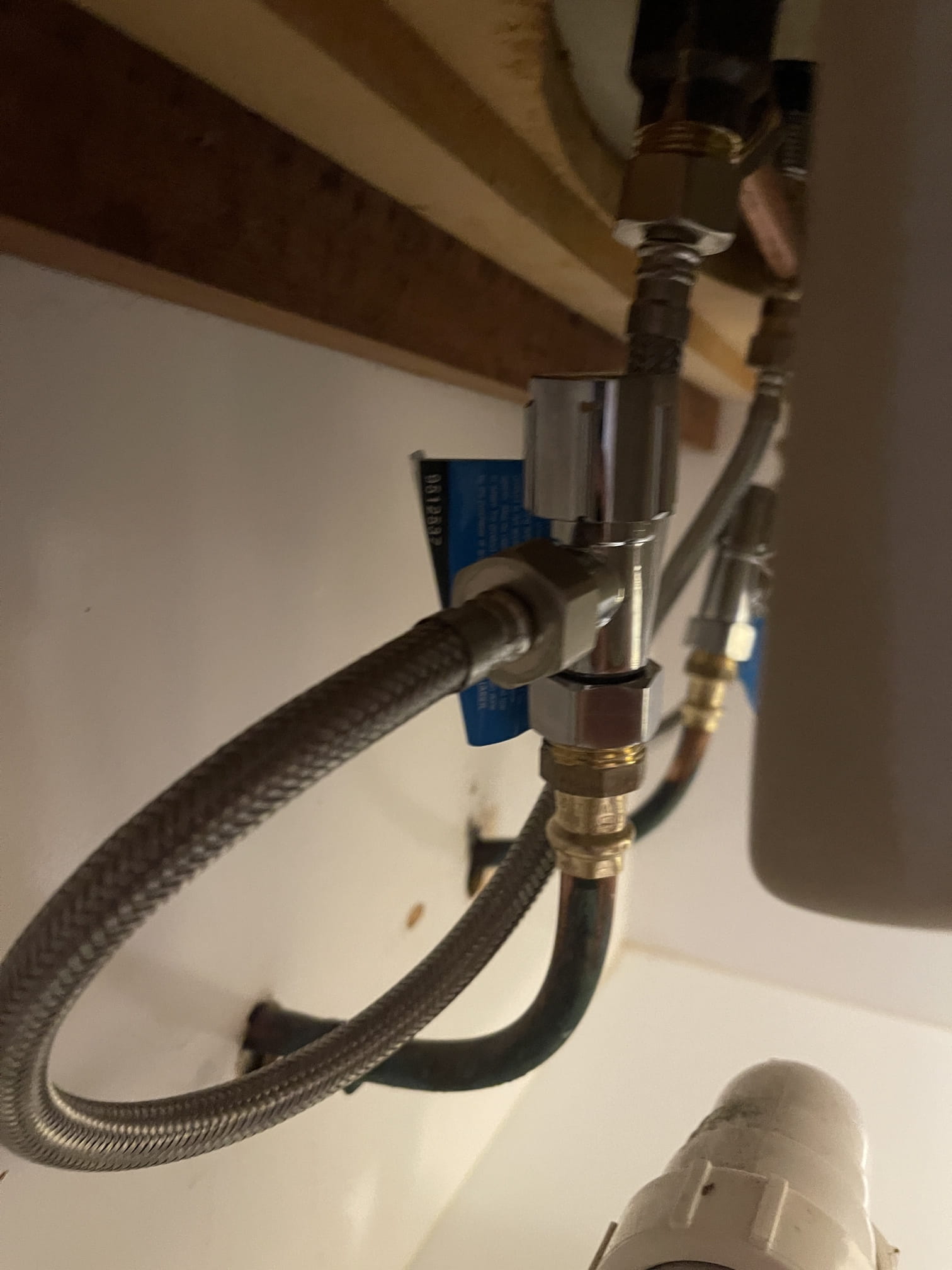 New mini stop and braided flexi hoses fitted under a basin in Woodlands