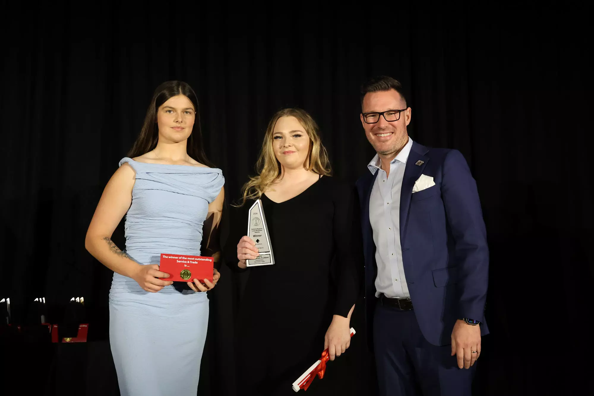 Sarah and Savannah holding the award.