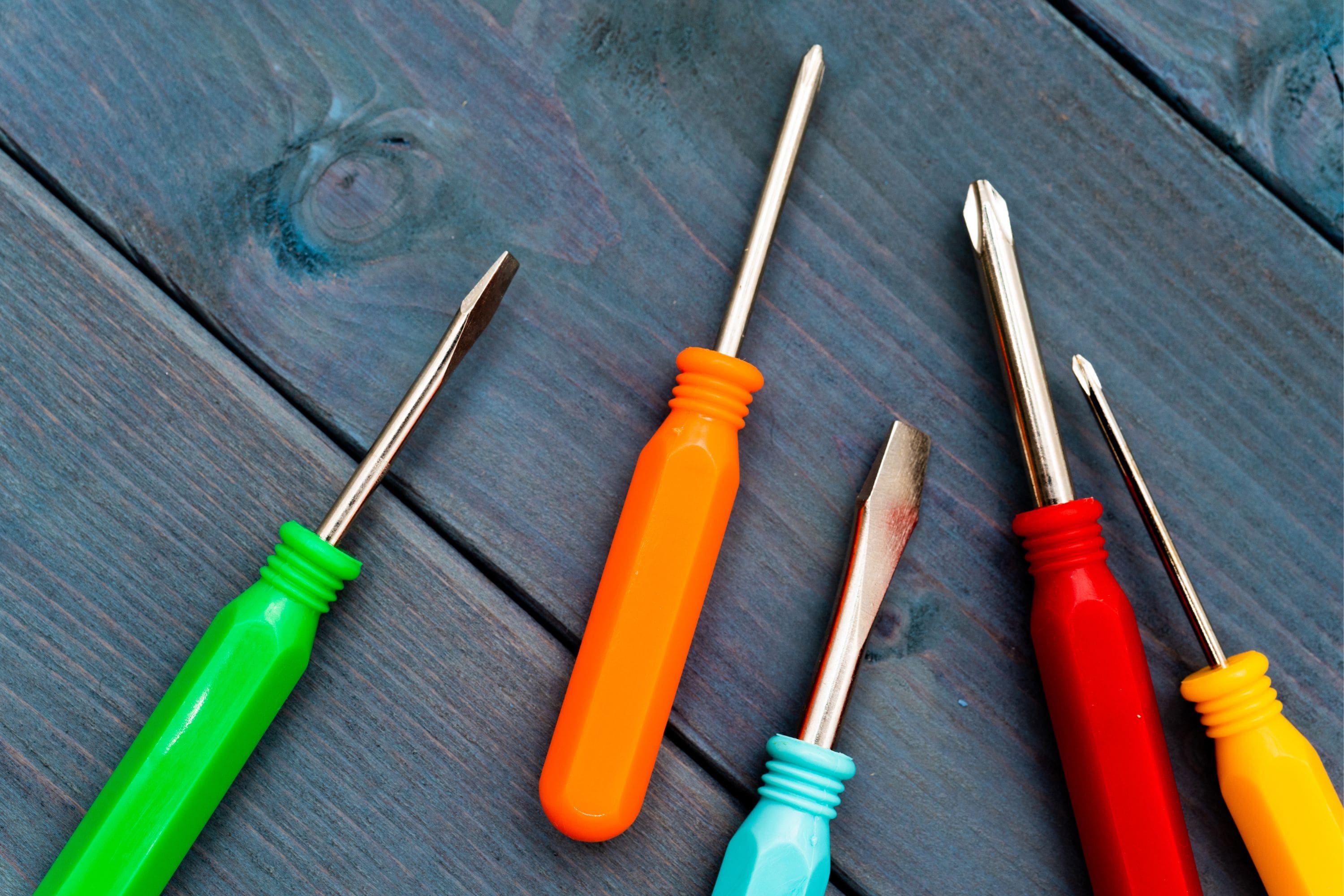 a screwdriver to fix a leaking tap 